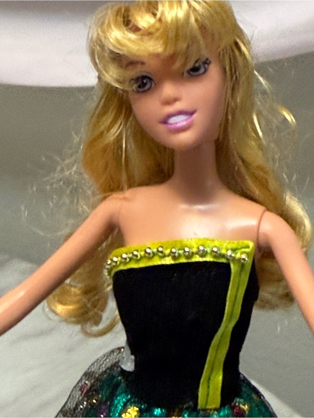 Disney sleeping beauty doll wearing green gown